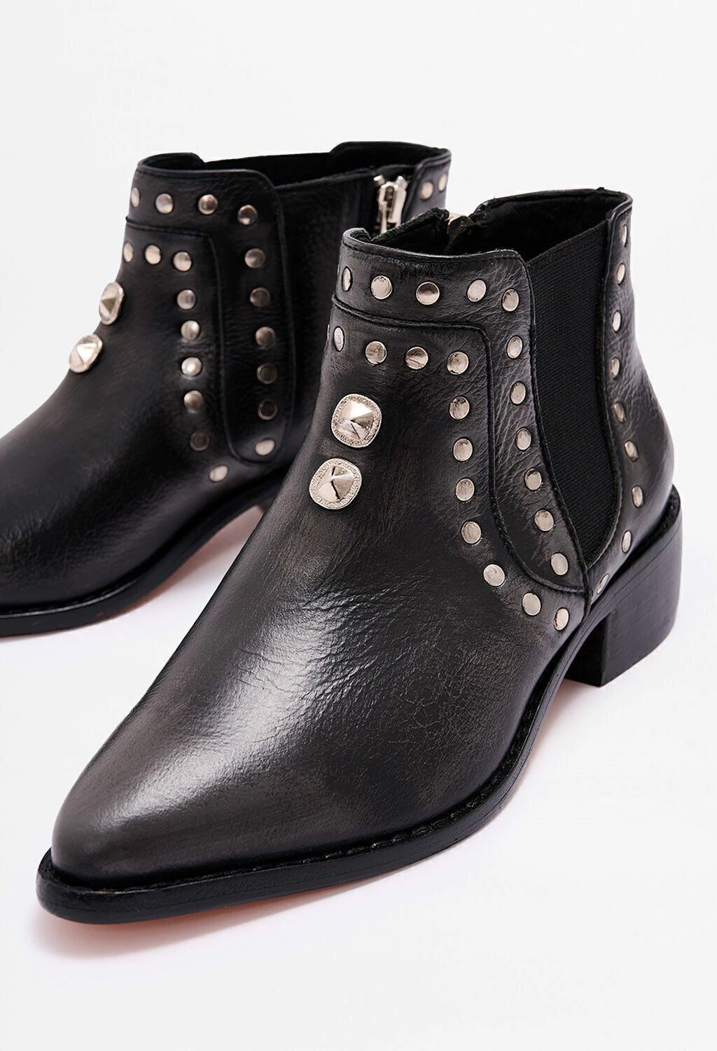Black leather ankle boots with silver studs