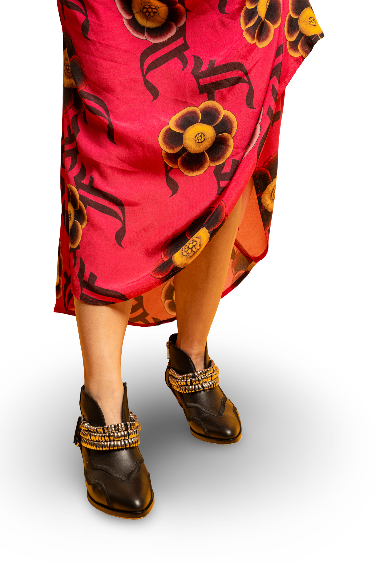 bright red dress with black floral patterns and brown boots