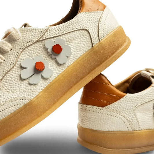 Beige sneakers with flower decorations