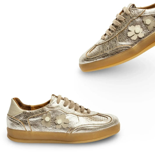 Gold sneakers with floral designs