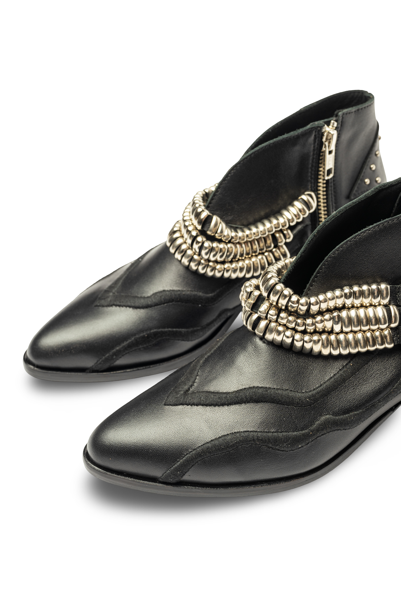 Black shoes with gold embellishments 